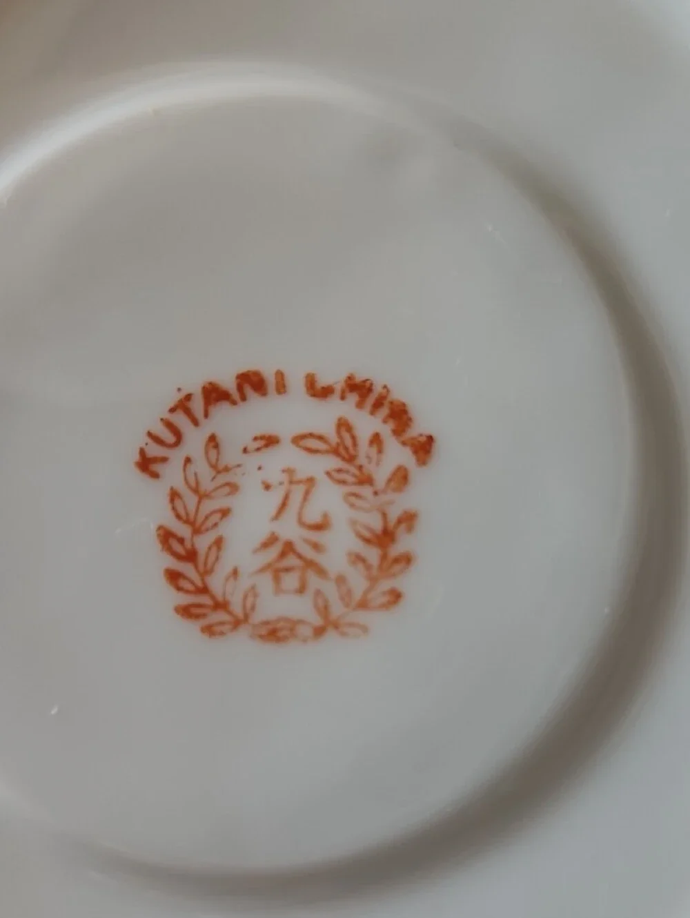Vintage Porcelain Teacup & Saucer Set in White with Blue and Tan Accents